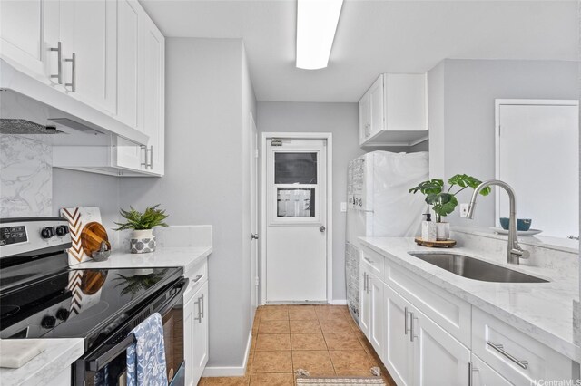 91-1021 Kuina St Unit 119, Ewa Beach, HI 96706 - kitchen featuring electric range, under cabinet range hood, white cabinetry, light tile patterned flooring, and light stone countertops