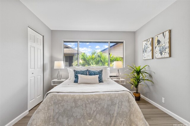 91-1021 Kuina St Unit 119, Ewa Beach, HI 96706 - bedroom featuring wood finished floors and a closet