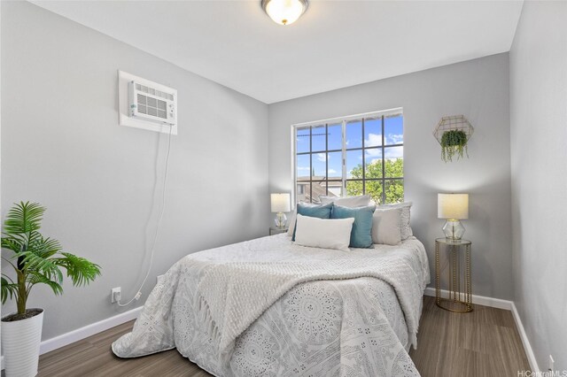 91-1021 Kuina St Unit 119, Ewa Beach, HI 96706 - bedroom featuring wood finished floors and an AC wall unit