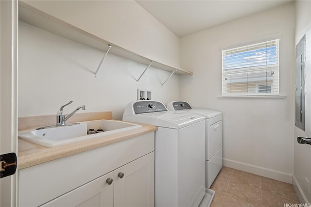 91-1108 Kaihohonu St, Ewa Beach, HI 96706 - washroom with separate washer and dryer, light tile patterned flooring, and cabinet space