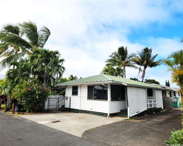 327 Hualani St Unit B, Kailua, HI 96734 - view of front of house featuring a gate and a metal roof