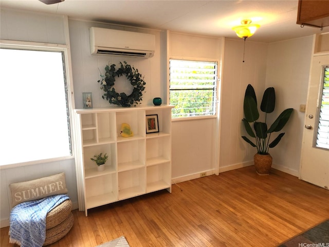 327 Hualani St Unit B, Kailua, HI 96734 - living area featuring a wall unit AC and wood-type flooring