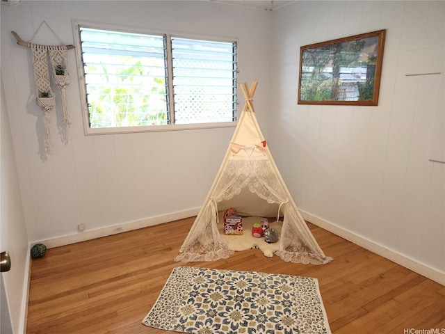 327 Hualani St Unit B, Kailua, HI 96734 - recreation room with light wood-type flooring and baseboards