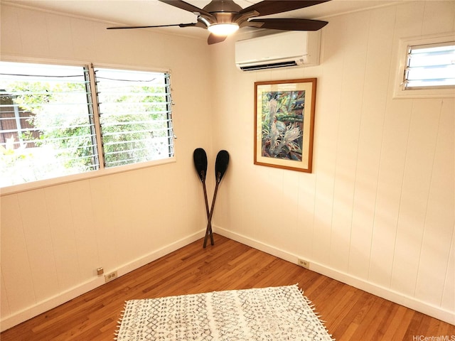 327 Hualani St Unit B, Kailua, HI 96734 - spare room featuring a wall mounted AC, light wood finished floors, and healthy amount of natural light