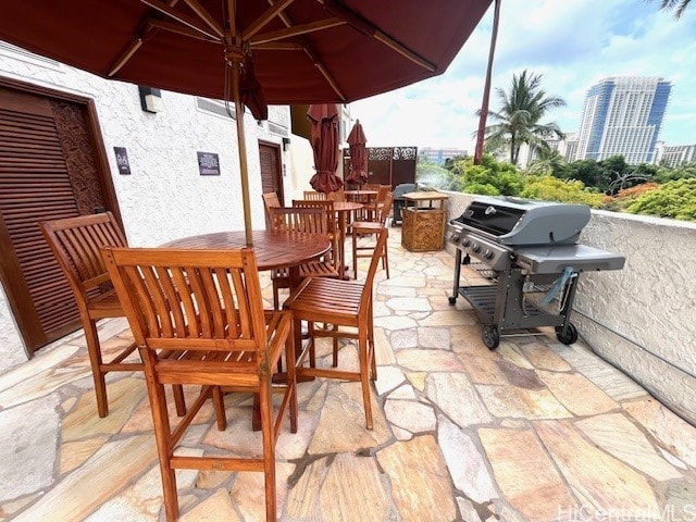 2045 Kalakaua Ave Unit 402, Honolulu, HI 96815 - view of patio featuring outdoor dining area and a grill