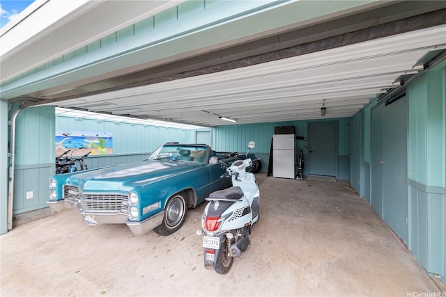 68-665 Hoomana Pl, Waialua, HI 96791 - garage featuring freestanding refrigerator and a carport