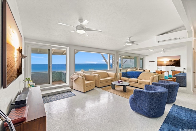 68-665 Hoomana Pl, Waialua, HI 96791 - living room with an AC wall unit, ceiling fan, a water view, plenty of natural light, and a textured ceiling