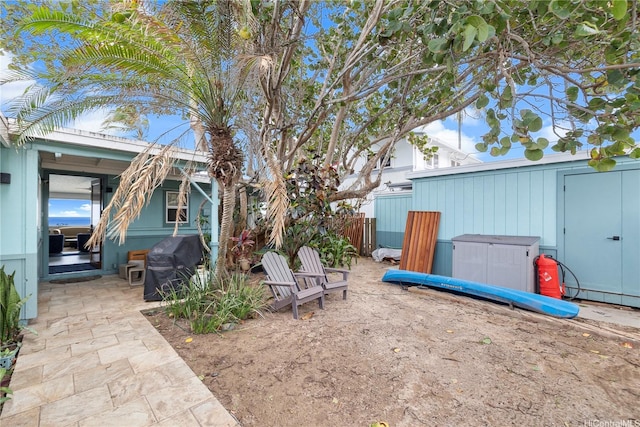 68-665 Hoomana Pl, Waialua, HI 96791 - view of yard featuring a patio area and a storage unit