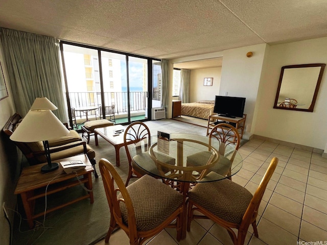 201 Ohua Ave Unit 2406, Honolulu, HI 96815 - dining area featuring a wall of windows, light tile patterned floors, and a textured ceiling