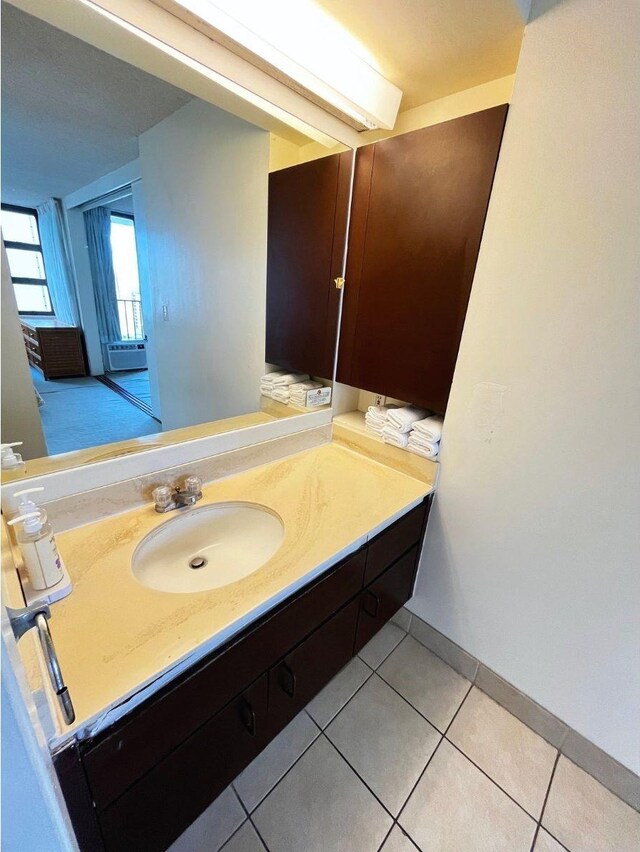 201 Ohua Ave Unit 2406, Honolulu, HI 96815 - bathroom featuring vanity and tile patterned flooring