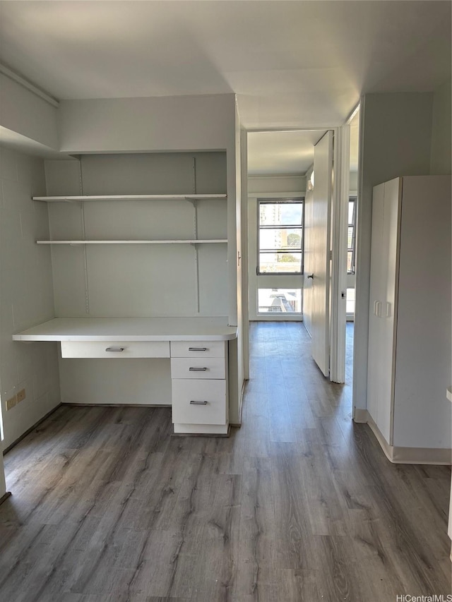 1616 Liholiho St Unit 803, Honolulu, HI 96822 - unfurnished office with built in study area and dark wood finished floors