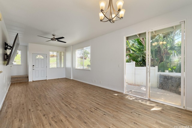 92-7049 Elele St Unit 54, Kapolei, HI 96707 - foyer featuring light wood-style flooring, a chandelier, and a ceiling fan