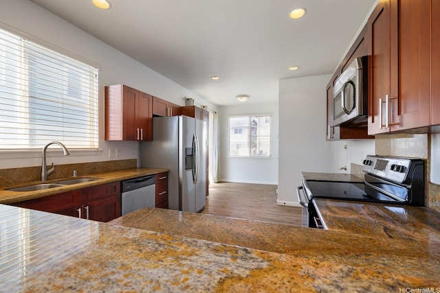 92-7049 Elele St Unit 54, Kapolei, HI 96707 - kitchen featuring stainless steel appliances, wood finished floors, recessed lighting, and backsplash
