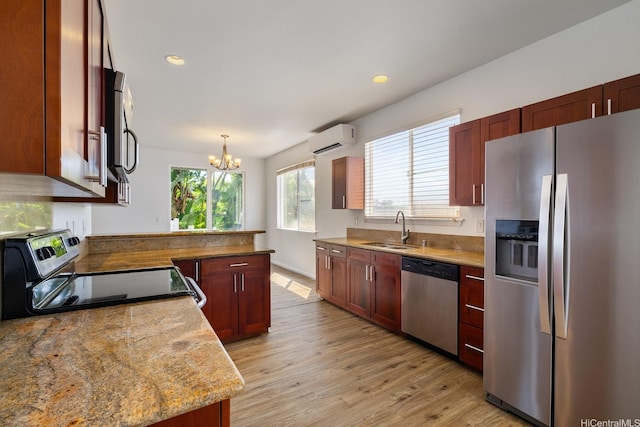 92-7049 Elele St Unit 54, Kapolei, HI 96707 - kitchen featuring appliances with stainless steel finishes, a wall mounted AC, a chandelier, light wood-type flooring, and a peninsula