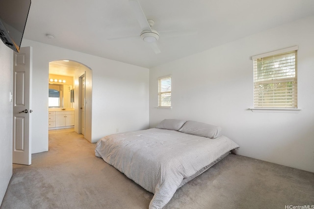 92-7049 Elele St Unit 54, Kapolei, HI 96707 - bedroom featuring light colored carpet, arched walkways, and a ceiling fan