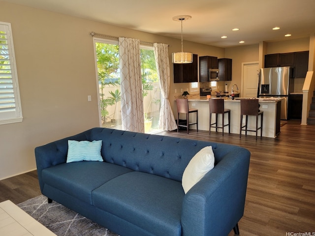 91-504 Kakaha St, Ewa Beach, HI 96706 - living room with dark wood-type flooring and recessed lighting