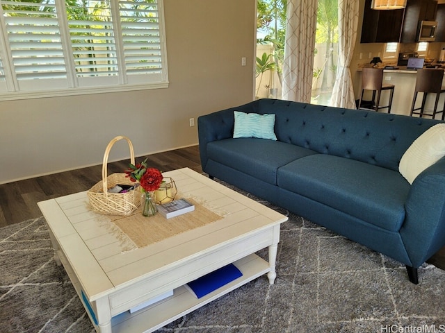91-504 Kakaha St, Ewa Beach, HI 96706 - living area with dark wood-style floors and baseboards