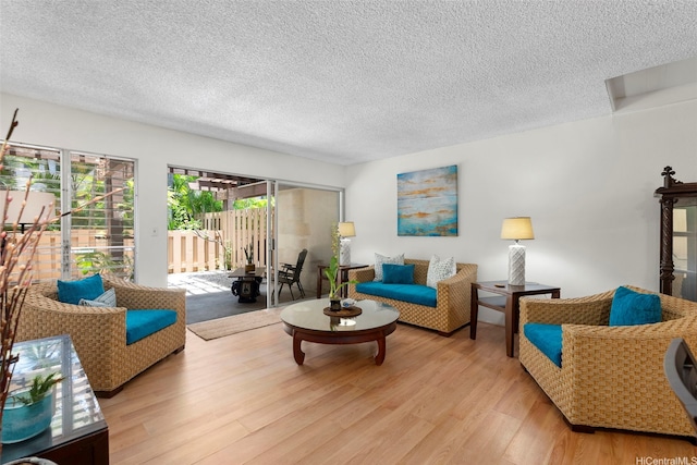 444 Lunalilo Home Rd Unit 602, Honolulu, HI 96825 - living area with wood finished floors and a textured ceiling