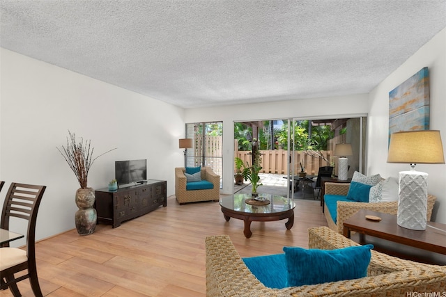 444 Lunalilo Home Rd Unit 602, Honolulu, HI 96825 - living area featuring wood finished floors and a textured ceiling