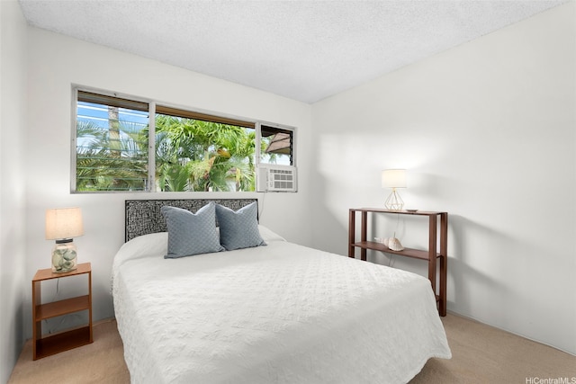 444 Lunalilo Home Rd Unit 602, Honolulu, HI 96825 - bedroom featuring light colored carpet, cooling unit, and a textured ceiling