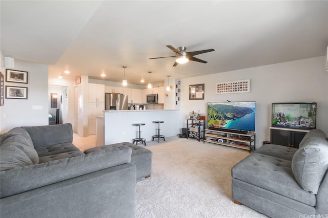 91-3525 Kauluakoko St Unit 2103, Ewa Beach, HI 96706 - living area with light colored carpet, a ceiling fan, and recessed lighting