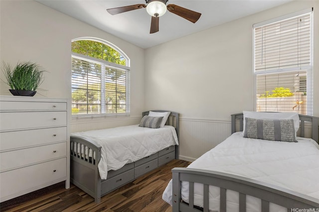 91-1023 Kaiee St, Ewa Beach, HI 96706 - bedroom featuring dark wood-type flooring, a wainscoted wall, and ceiling fan