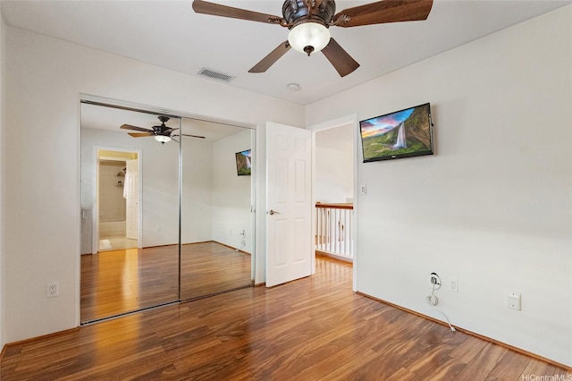 91-1023 Kaiee St, Ewa Beach, HI 96706 - unfurnished bedroom featuring wood finished floors, a closet, and ceiling fan