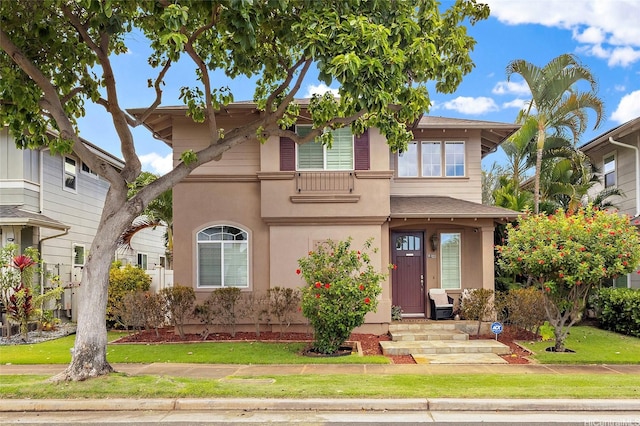 91-1023 Kaiee St, Ewa Beach, HI 96706 - view of front facade with stucco siding and a front lawn
