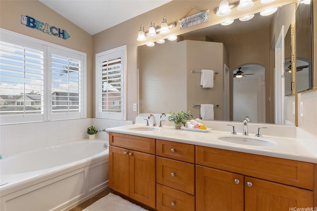 91-1023 Kaiee St, Ewa Beach, HI 96706 - full bathroom with double vanity, a ceiling fan, a bath, vaulted ceiling, and tile patterned flooring