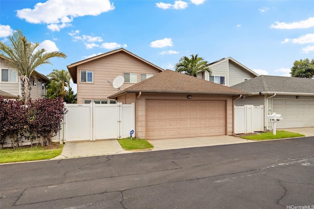 91-1023 Kaiee St, Ewa Beach, HI 96706 - traditional-style house featuring a gate, a garage, and driveway