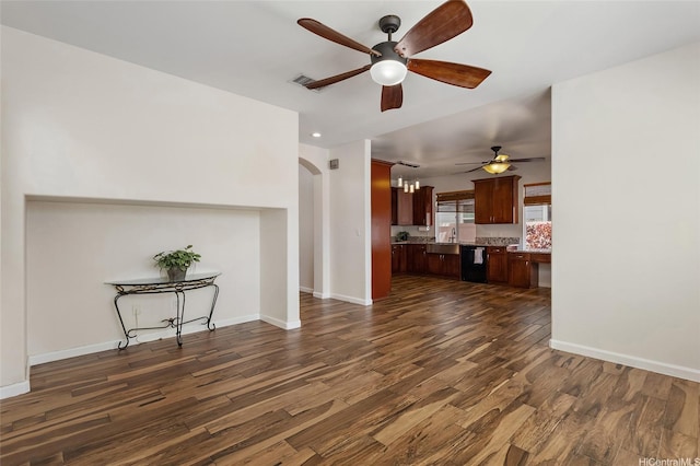 91-1023 Kaiee St, Ewa Beach, HI 96706 - unfurnished living room with ceiling fan, dark wood-style flooring, and arched walkways