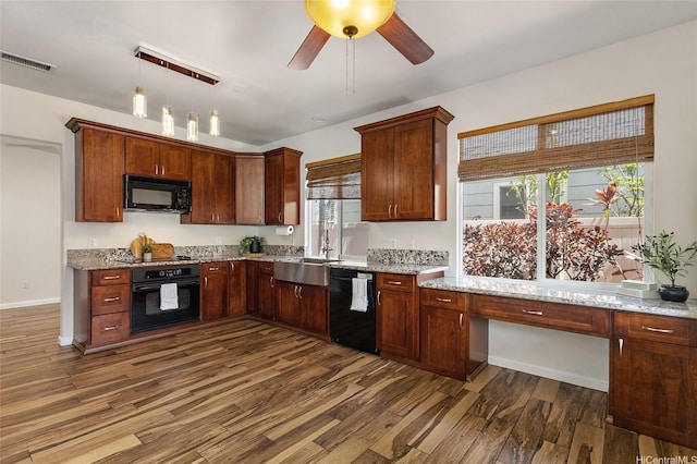 91-1023 Kaiee St, Ewa Beach, HI 96706 - kitchen with black appliances, dark wood-style floors, and light stone countertops
