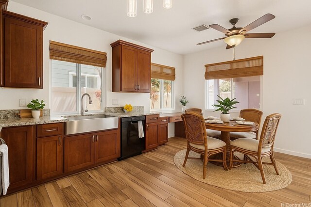 91-1023 Kaiee St, Ewa Beach, HI 96706 - kitchen with dishwasher, light wood-style floors, light stone counters, and a ceiling fan
