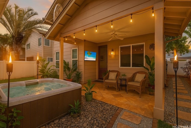 91-1023 Kaiee St, Ewa Beach, HI 96706 - patio terrace at dusk with a hot tub, a patio area, and ceiling fan