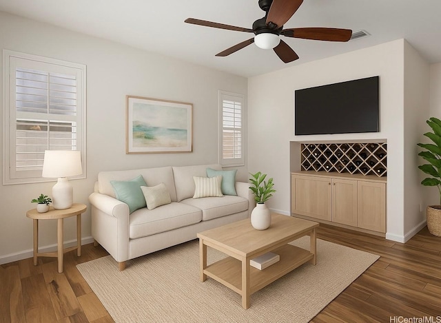 91-1023 Kaiee St, Ewa Beach, HI 96706 - living area featuring a ceiling fan and wood finished floors