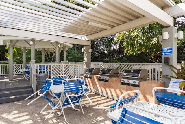239 Mananai Pl Unit 54H, Honolulu, HI 96818 - view of patio featuring an outdoor kitchen, a wooden deck, and a pergola