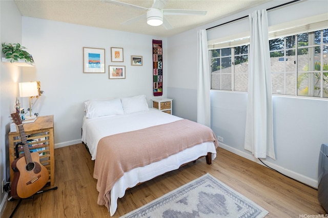 239 Mananai Pl Unit 54H, Honolulu, HI 96818 - bedroom featuring light wood-style flooring and ceiling fan