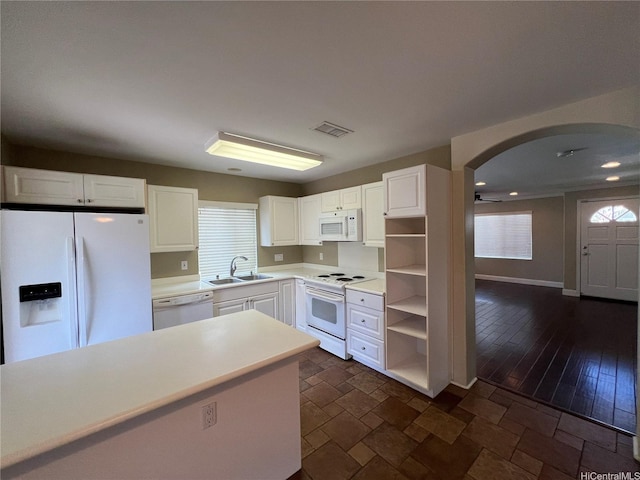 91-1035 Kaiko St, Ewa Beach, HI 96706 - kitchen with white appliances, arched walkways, open shelves, white cabinets, and light countertops