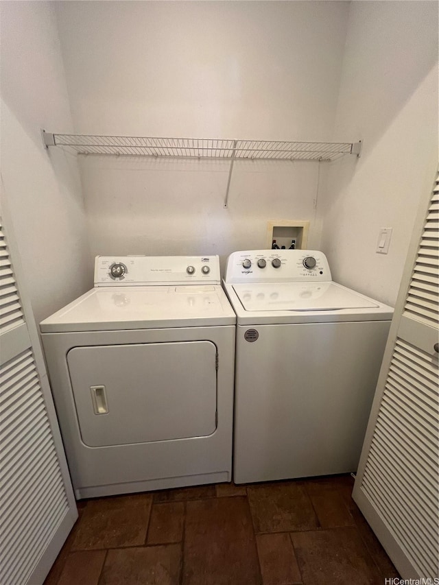 91-1035 Kaiko St, Ewa Beach, HI 96706 - laundry room with washer and clothes dryer and dark stone finish flooring