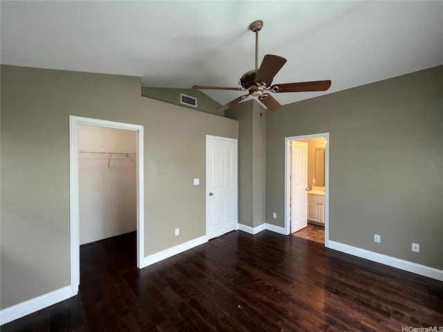 91-1035 Kaiko St, Ewa Beach, HI 96706 - unfurnished bedroom featuring dark wood-style floors, a spacious closet, lofted ceiling, a closet, and a ceiling fan