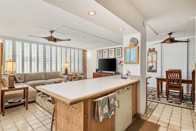 2801 Coconut Ave Unit 2D, Honolulu, HI 96815 - kitchen featuring ceiling fan, a peninsula, light countertops, light tile patterned floors, and recessed lighting