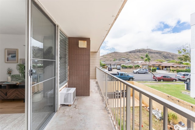 5055 Likini St Unit D226, Honolulu, HI 96818 - balcony with a mountain view, cooling unit, and a residential view