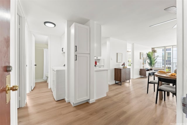5055 Likini St Unit D226, Honolulu, HI 96818 - hallway with light wood finished floors and washer / dryer