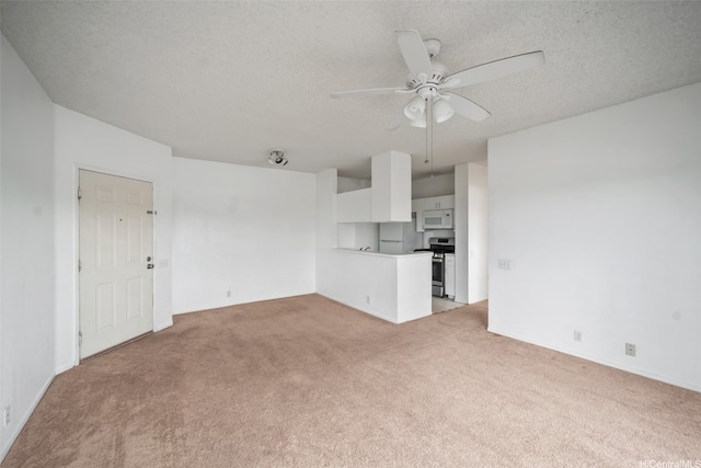 91-234 Hanapouli Cir Unit 28J, Ewa Beach, HI 96706 - unfurnished living room with light colored carpet, a ceiling fan, and a textured ceiling
