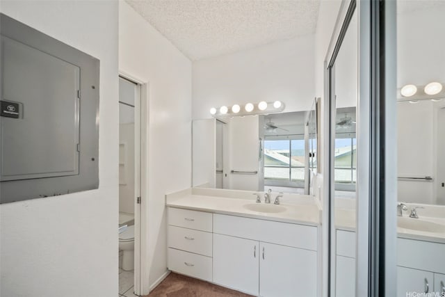 91-234 Hanapouli Cir Unit 28J, Ewa Beach, HI 96706 - bathroom with electric panel, vanity, a textured ceiling, and ceiling fan