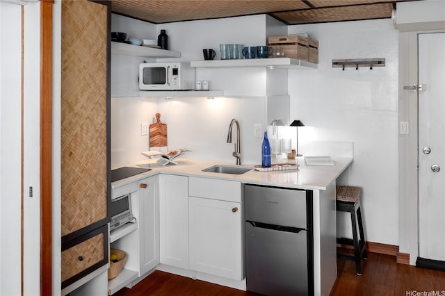 2463 Kuhio Ave Unit 1107, Honolulu, HI 96815 - kitchen with open shelves, freestanding refrigerator, white microwave, and dark wood finished floors