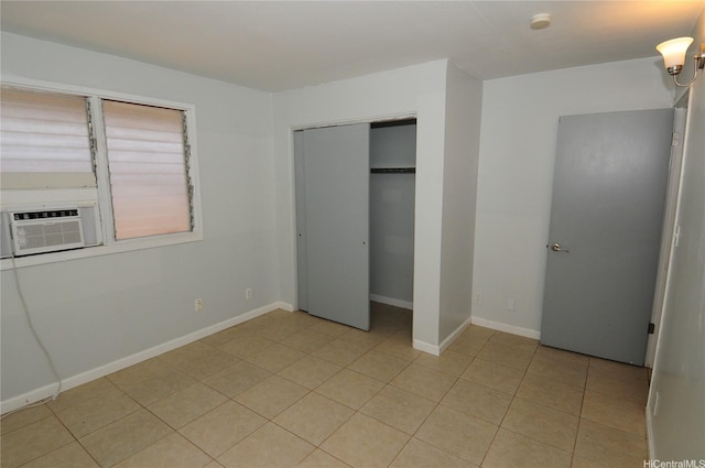 1028 Hooli Pl Unit A, Pearl City, HI 96782 - unfurnished bedroom with light tile patterned floors, a closet, and cooling unit