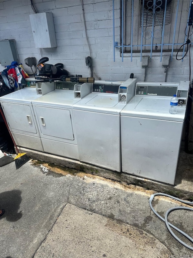 729 Kinau St, Honolulu, HI 96813 - community laundry room featuring washer and clothes dryer and concrete block wall
