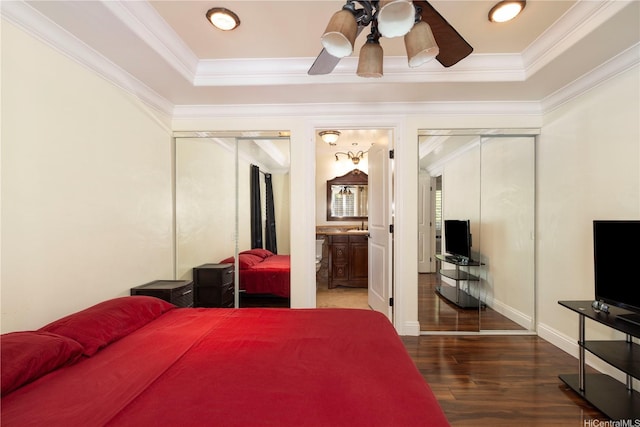 95-536 Wikao St Unit D106, Mililani, HI 96789 - bedroom featuring wood finished floors, crown molding, a raised ceiling, connected bathroom, and ceiling fan