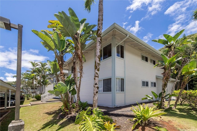 95-536 Wikao St Unit D106, Mililani, HI 96789 - view of side of home featuring a yard